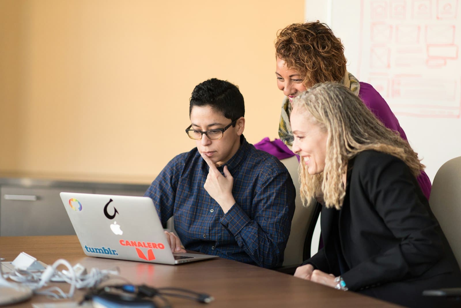 Business professionals reviewing an IT services proposal on a tablet